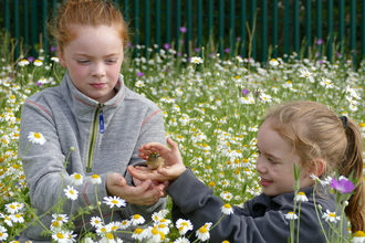 Girls with bird in hand