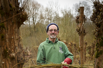 Malcolm volunteering on a reserve