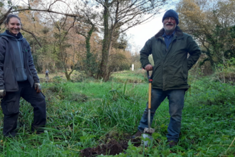 Laia and Phil tree planting at Balloo Woodland 