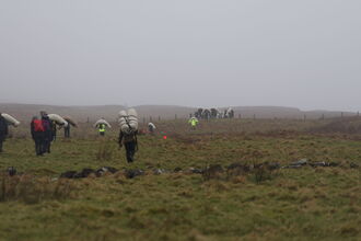 Wool logs being carried up to Slievenanee