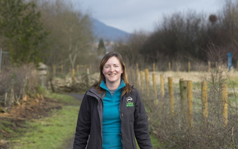 Deborah with a wheelbarrow on a nature reserve