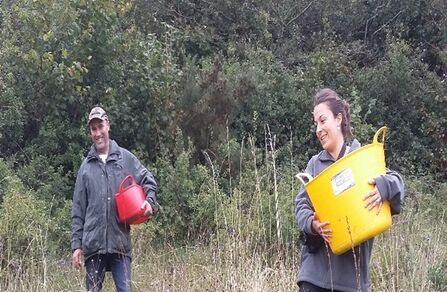 George and Eva gathering wildflower seed at Fedian in 2015